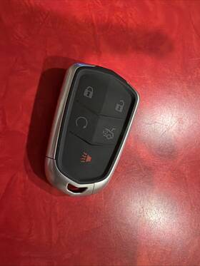0254 Oem 1 Preowned Cadillac/gm Key Fob With New Uncut Blank 315 Mhz