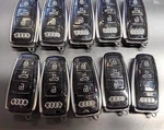 Lot Of 10 Oem Audi Smart Key Fob Remotes IYZ-AK2 4 Buttons. Fixed Price $115.00.