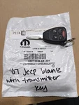 Genuine Mopar Blank With Transmitter Key 68273336AB. Fixed Price $104.99.