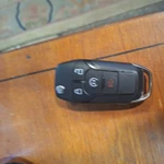 Ford JL1T-15K601-AC Oem 4 Button Key Fob. Fixed Price $18.00.