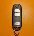 Mazda Button Key Fob Model (fcc: WASKE13D02 Ic: 662F-SKE13D02). Fixed Price $90.00.
