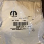 Genuine Mopar Blank With Transmitter Key 68273339AC. Fixed Price $125.00.