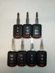 Lot Of 7 Oem Mitsubishi Head Key Fob Remotes OUCJ166N 4 Buttons. Fixed Price $140.00.